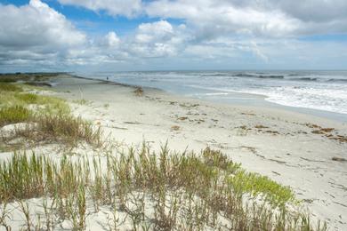 Sandee Sunset Strip Beach Photo