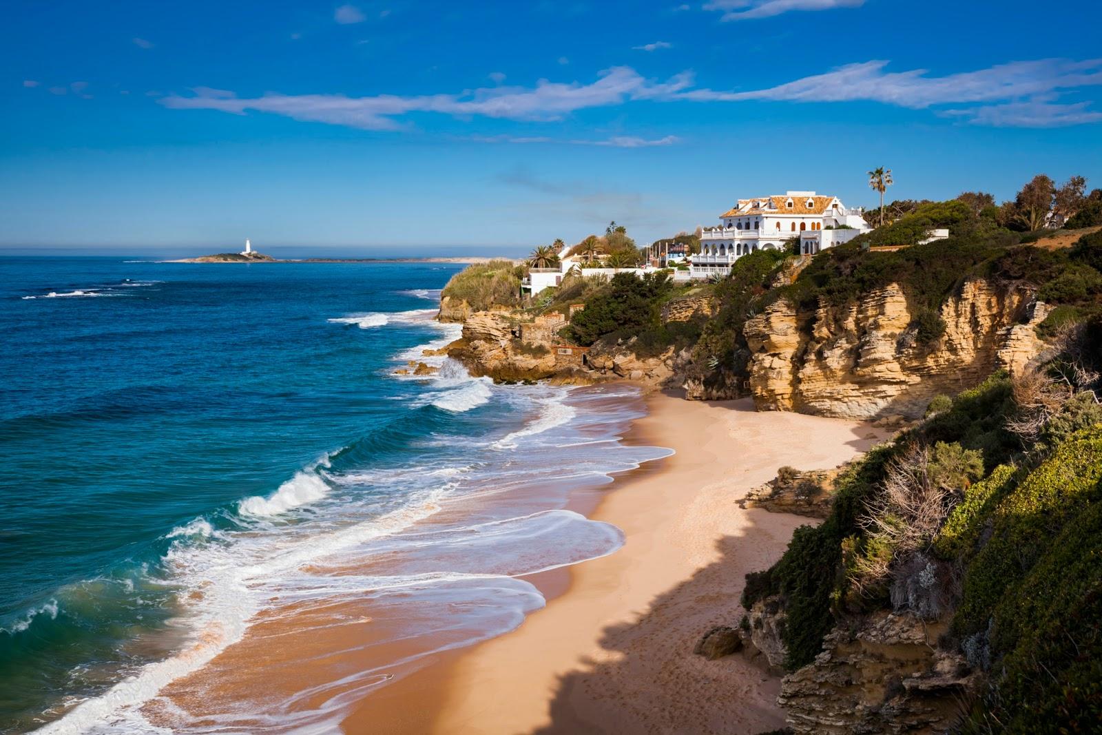 Sandee Beach Of Canos De Meca Photo