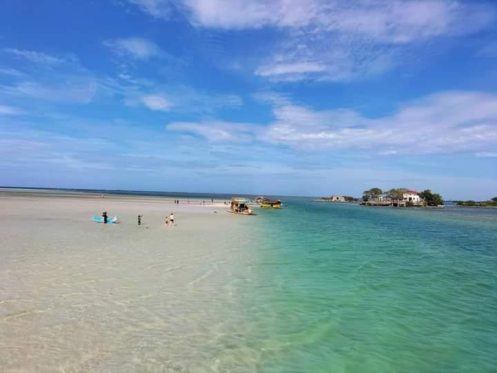 Sandee Crystal Beach White Sandbar And Mini Boracay