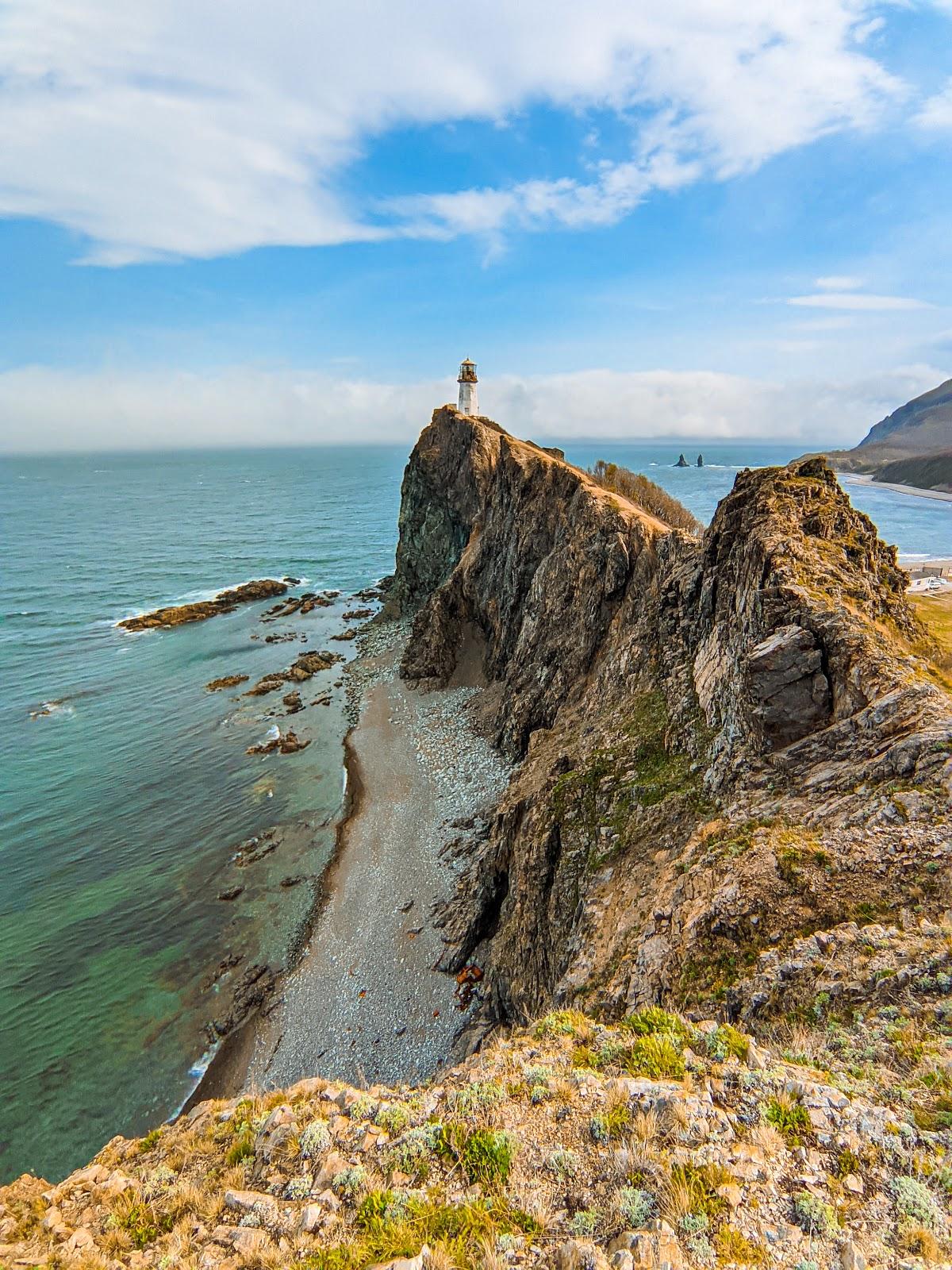 Sandee Lighthouse At Cape Briner Photo