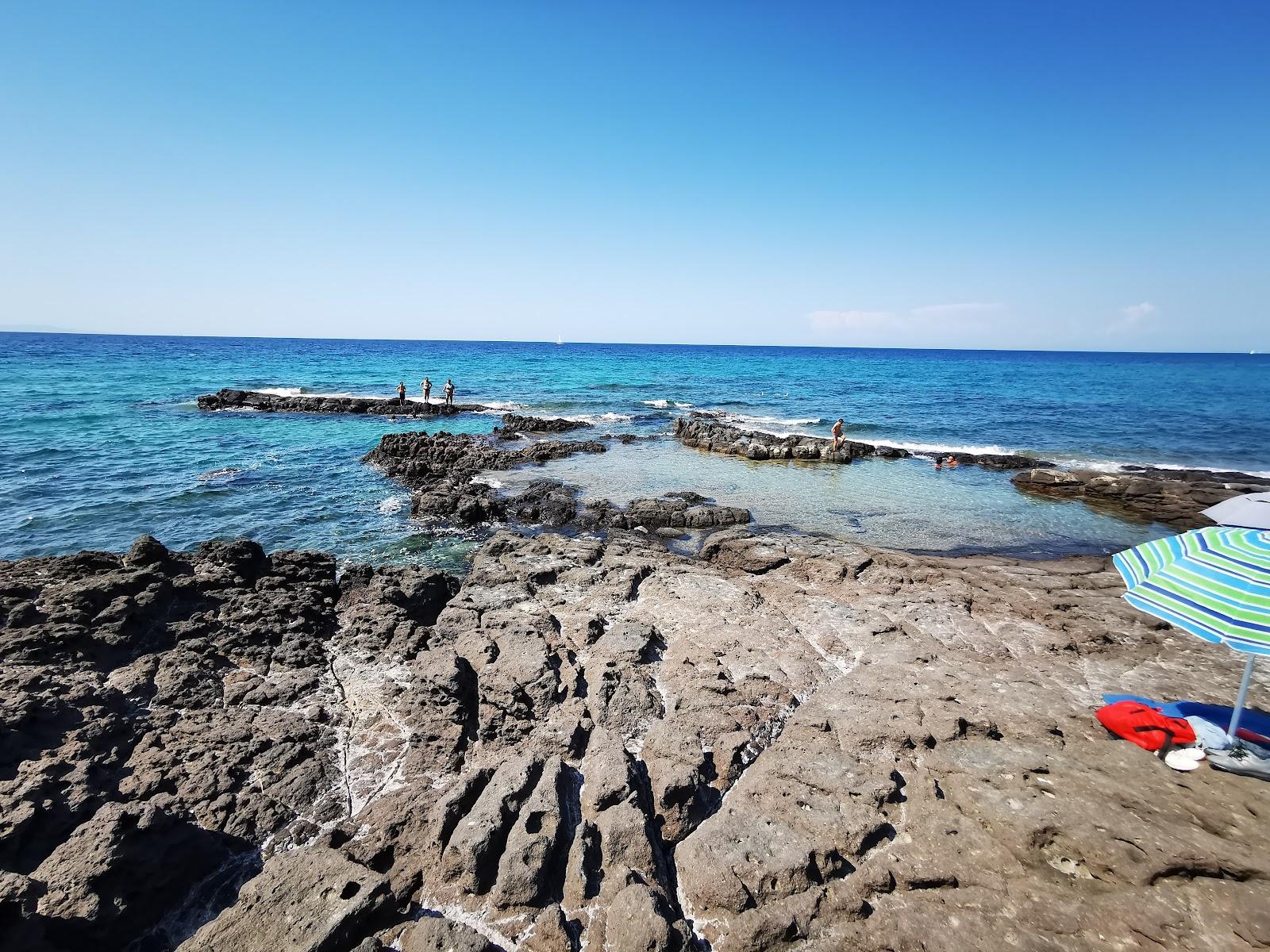 Sandee Spiaggia Delle Piscine Lu Bagnu Photo